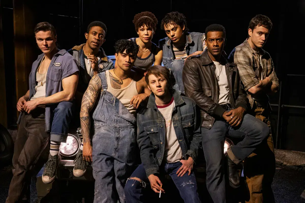 The Outsiders cast on stage