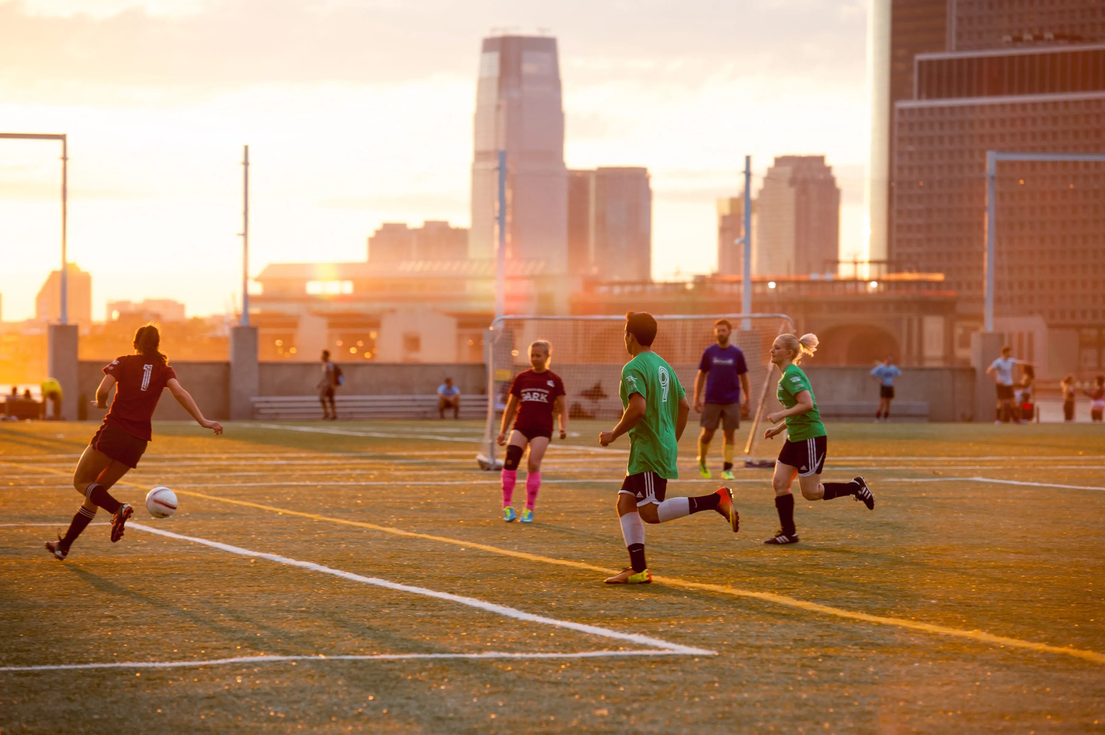 People playing soccer at Pier 5 in Brooklyn Bridge Park 