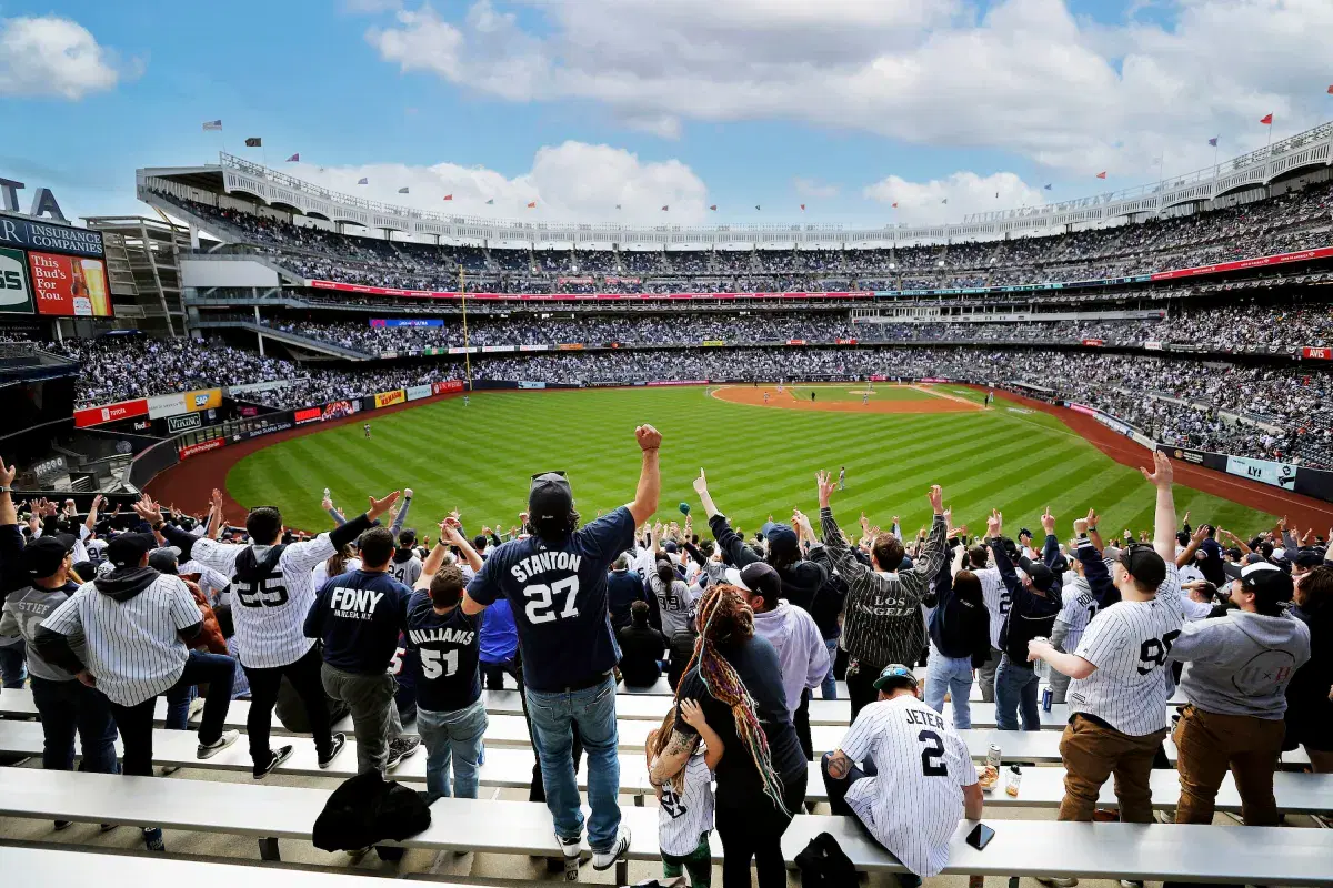 Fans cheering at Yankee Stadium in the Bronx