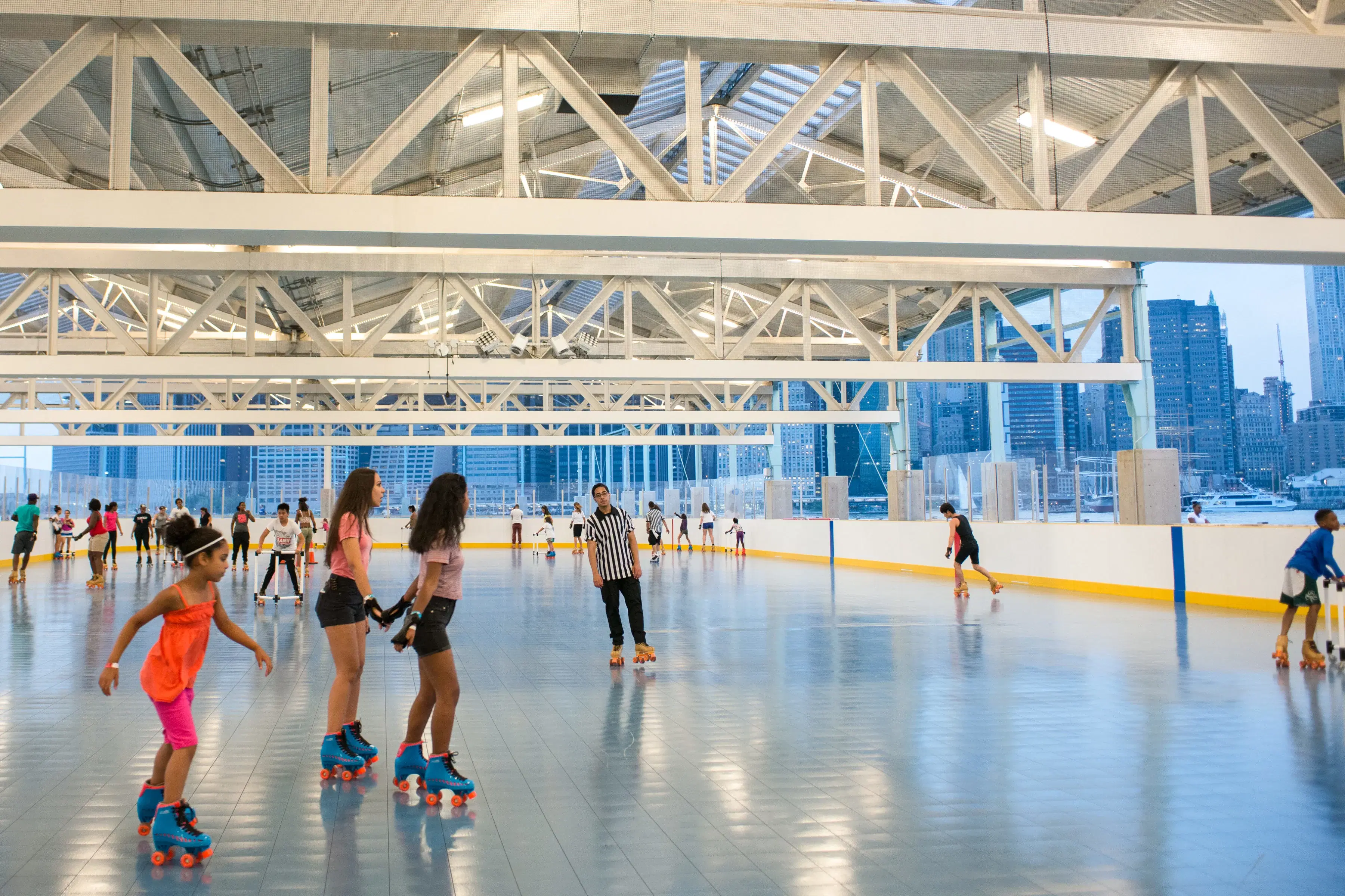 People roller skating at Pier 2 in Brooklyn Bridge Park 