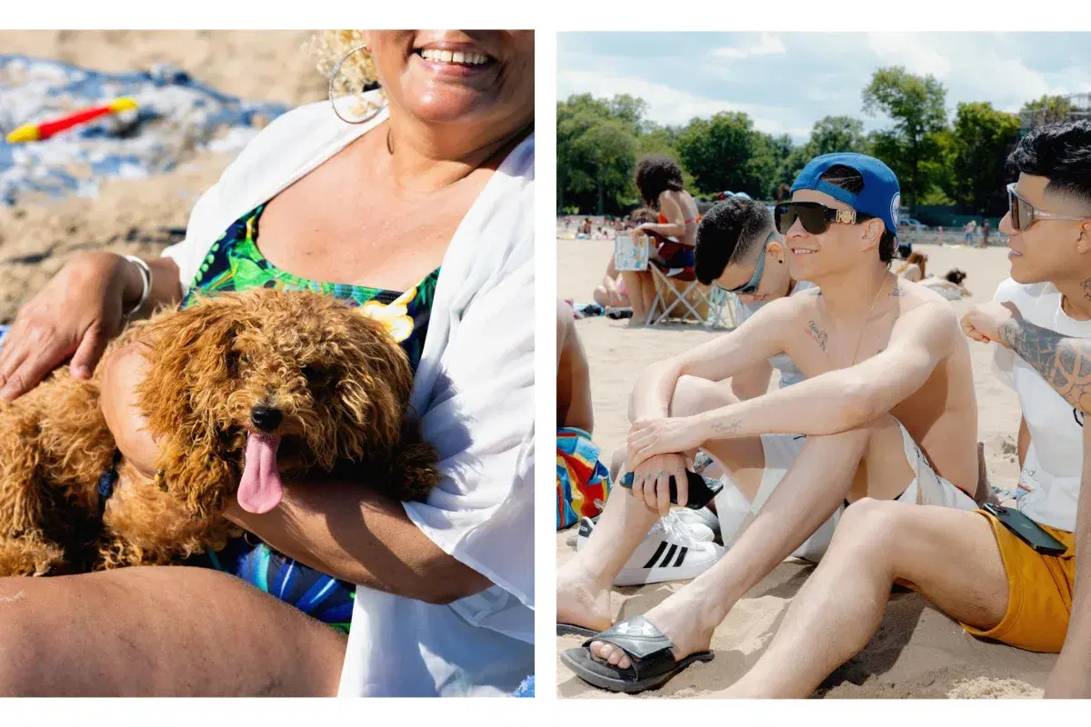 Person with dog on lap and people posing in front of the ocean