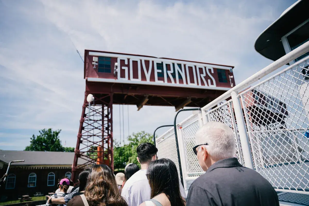 People walk from the ferry to the Governors Island entrance