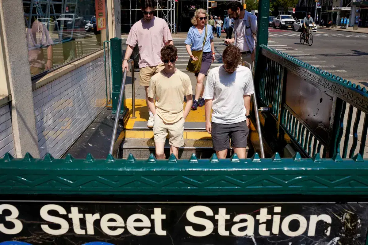 Group of people walking into subway