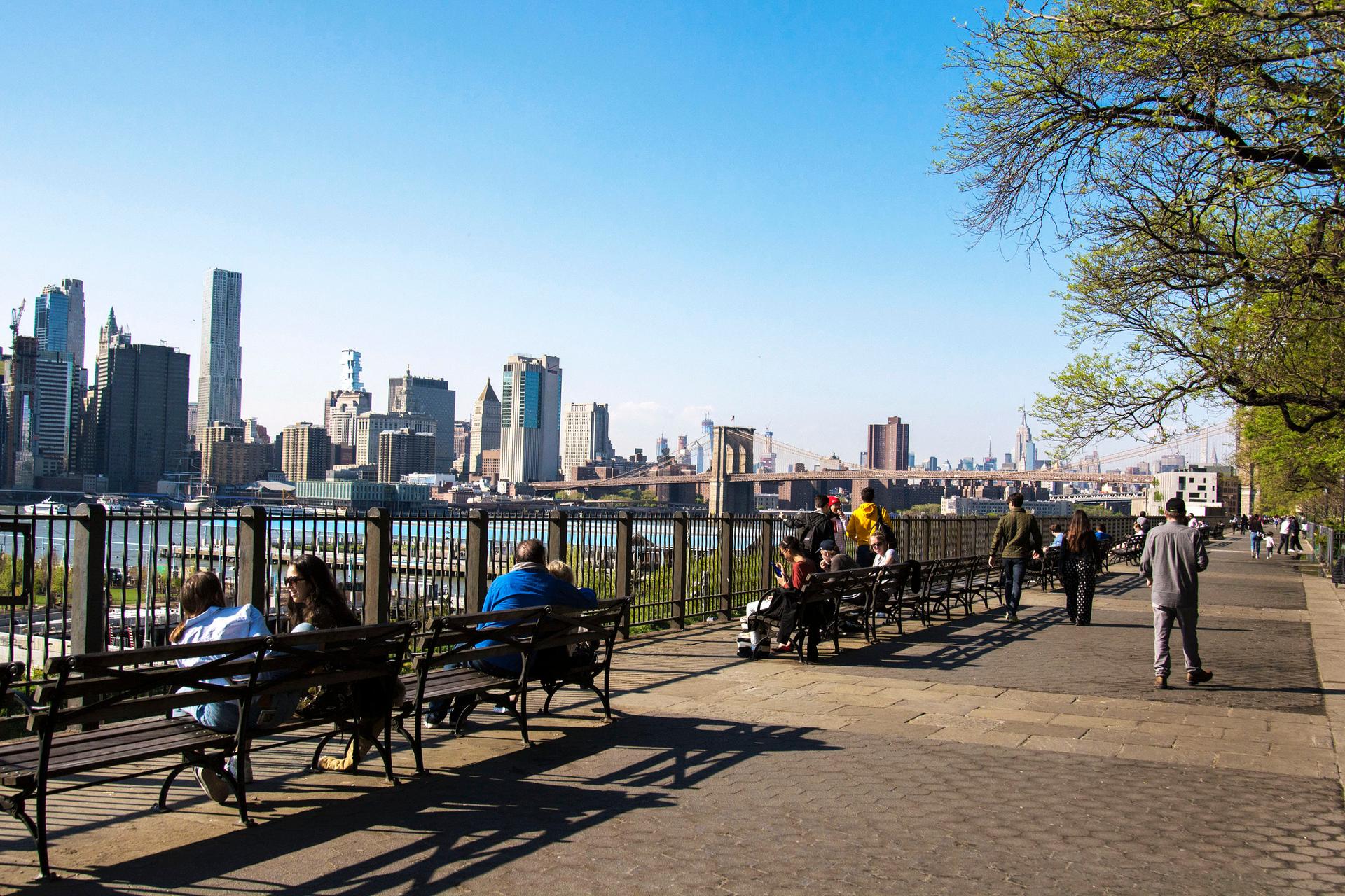 people sitting on benches, at Brooklyn Heights Promenade