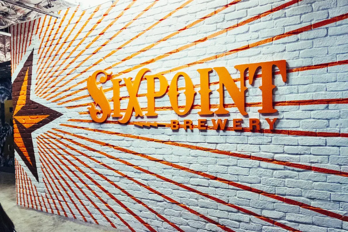 Wall with sixpoint brewery logo