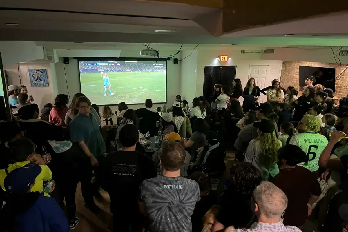 People watching soccer at Crossbar