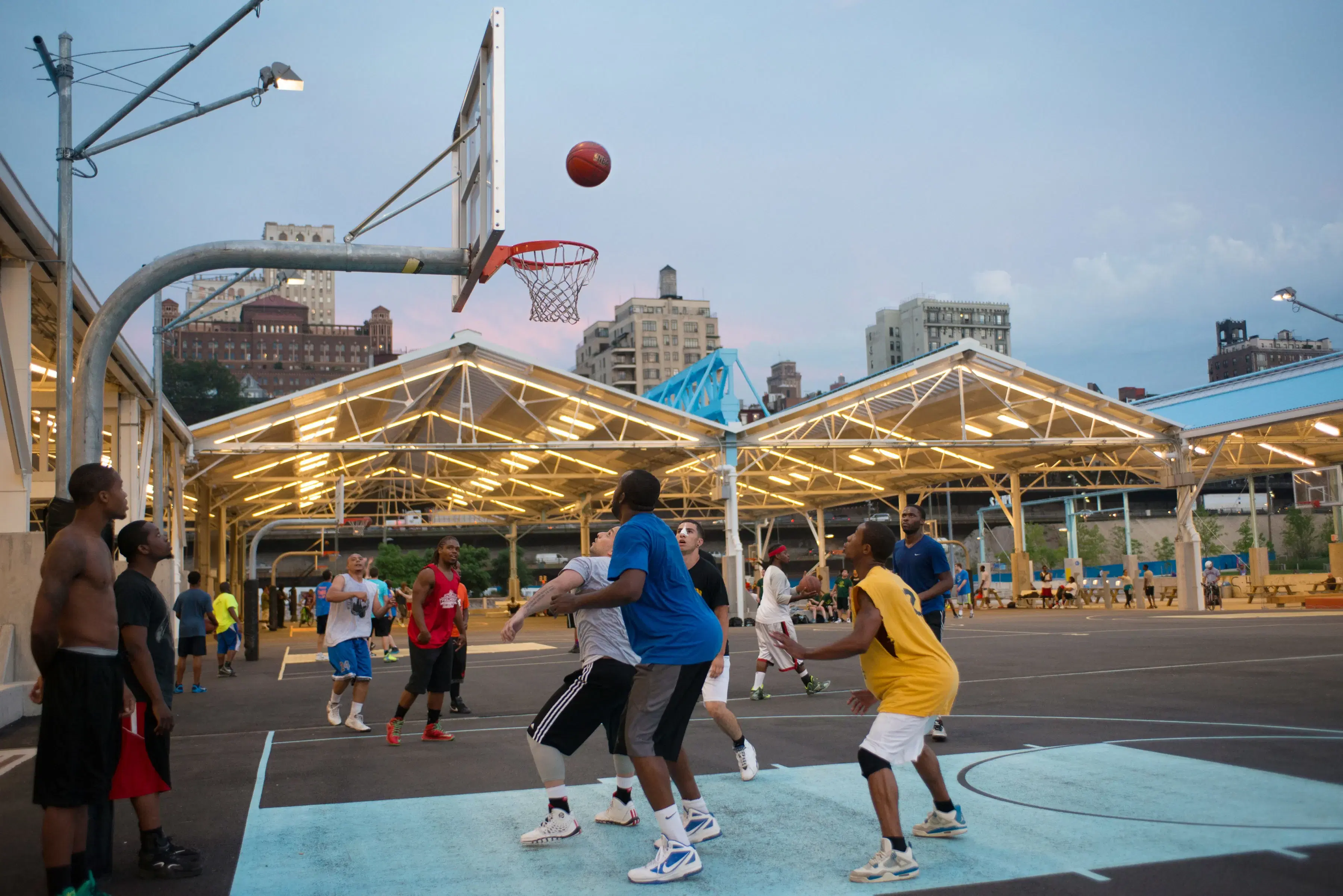 People playing basketball at Pier 2 in Brooklyn Bridge Park 