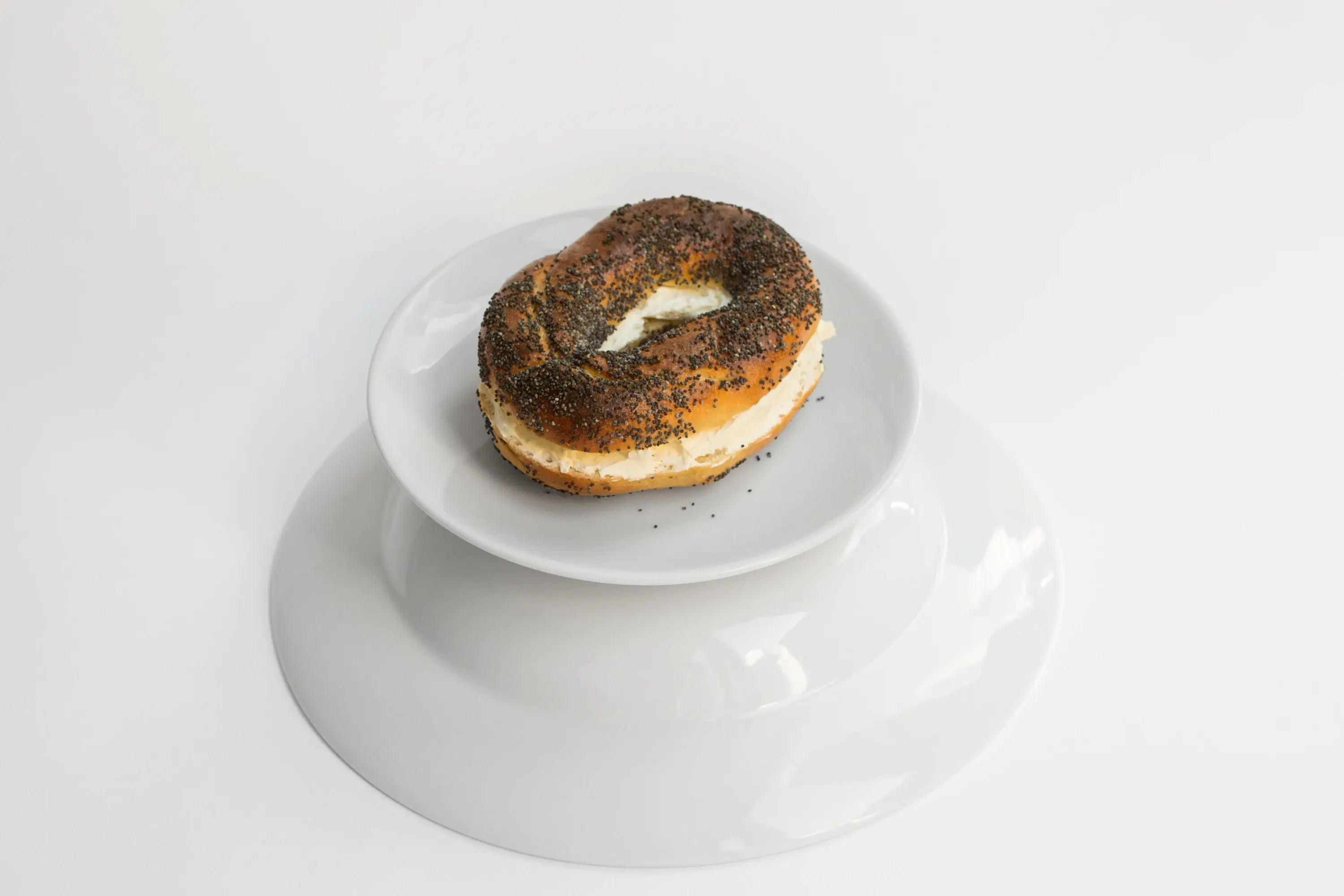 Poppy seed bagel with cream cheese from Black Seed Bagels