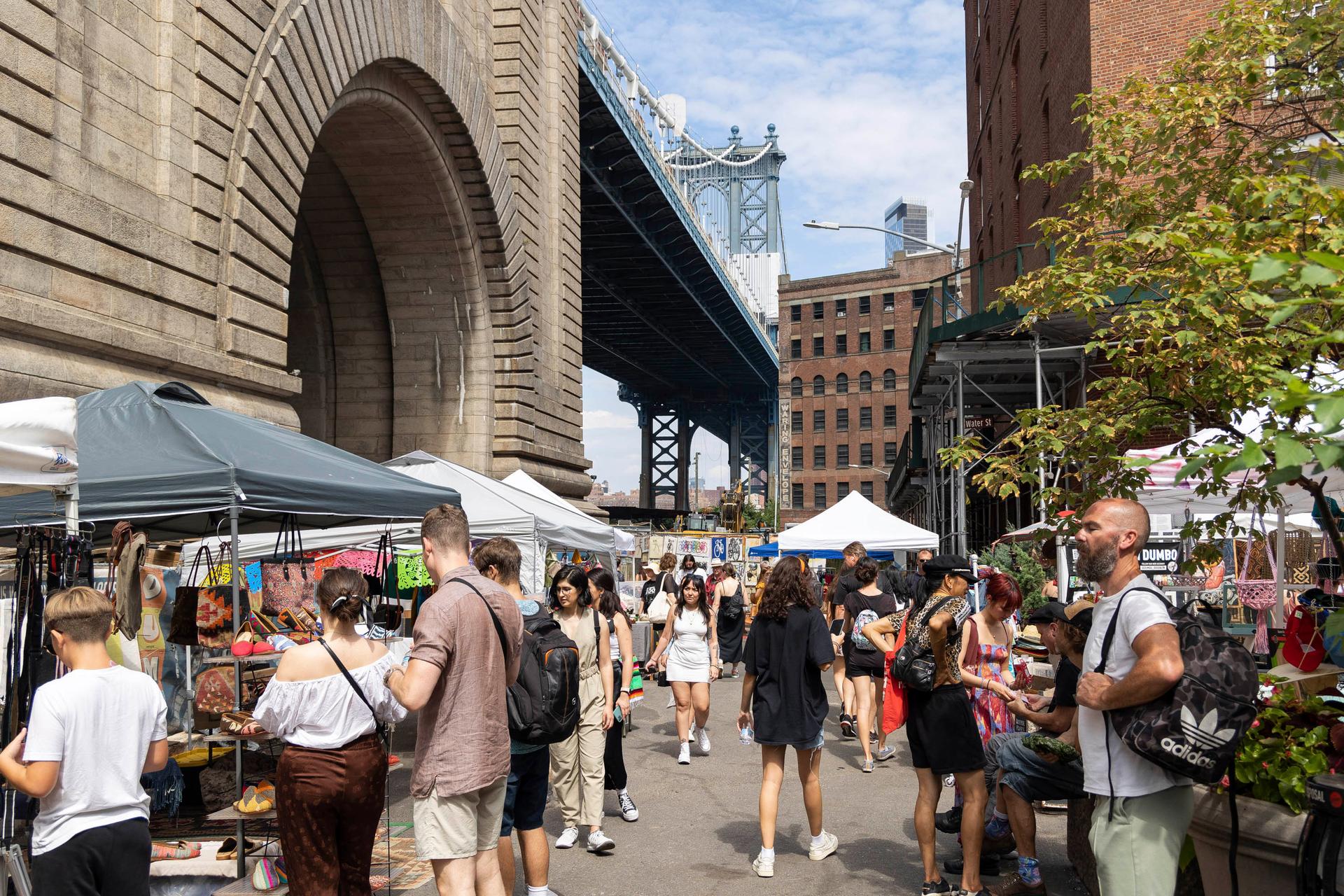 people shopping at, the Brooklyn Flea in Brooklyn
