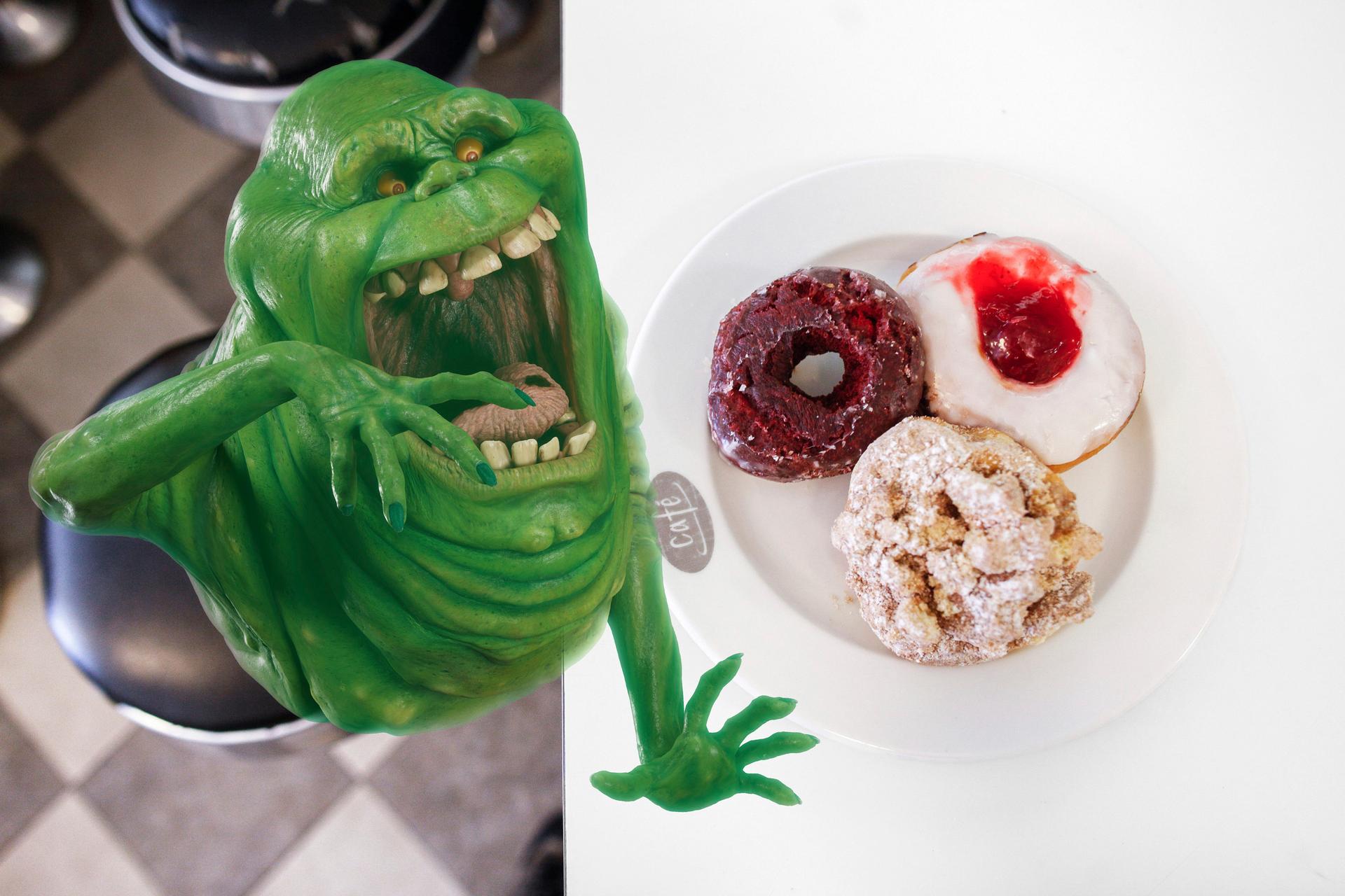 Slimer from Ghostbusters eating donuts at Peter Pan Donut & Pastry Shop.