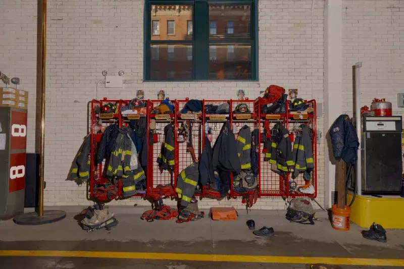 Firefighter uniforms hanging inside fire station
