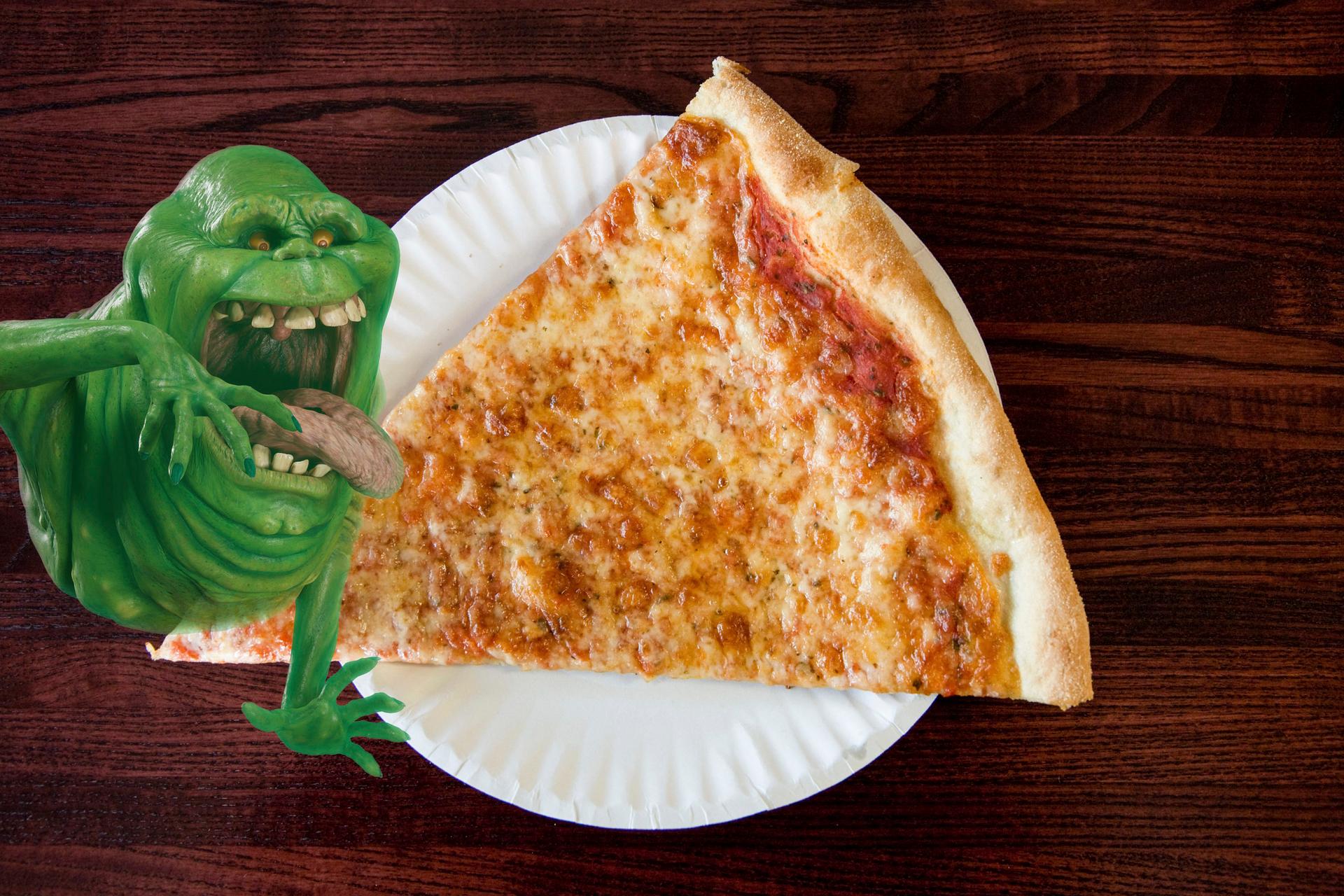 Slimer from Ghostbusters eating pizza at Full Moon Pizza